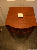 Full view of the mahogany top surface showing overall shape and finish.