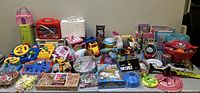 Wide view of entire assortment of toys across the table