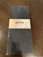 Closed box with label indicating Harry Potter Quill Stand and Ink Set from Universal Studios