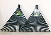 Both ProYard black plastic lawn rakes side by side against a white background showing their size and shape.