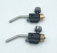 Photo shows two black self igniting torch heads with metal curved nozzles and attached igniter buttons on white background.