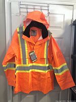Full frontal image of bright orange Viking safety jacket with reflective strips and attached hood.