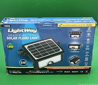 Photo of the LightWay Multi-Functional Solar Flood Light box showing product features and specifications