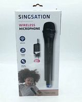 Singsation wireless microphone retail box with image of microphone and rechargeable VHF receiver with 1/4 inch plug.