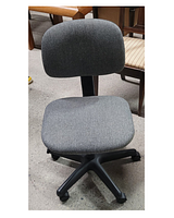 Front view of modern padded desk chair upholstered in dark grey fabric, with black plastic base and wheels.