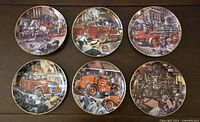 Set of six decorative Franklin Mint plates showing fire engines from various historical times, arranged in two rows of three