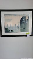 Full view of the framed watercolor painting depicting a fisherman on the Yangtze River with tall cliffs in the background.