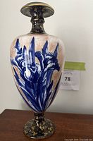 Front view of the Royal Doulton Blue Daffodil vase showing the blue daffodil floral design and gold detailing