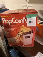 Presto brand popcorn popper in original box, unopened and in new condition.