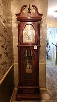 Full view of the Ridgeway grandfather clock showing the wooden case and decorative details.