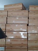 Stacked cardboard boxes containing the LED spotlights.