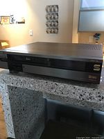 Front angle view of JVC S-VHS VCR showing brand and model details on the top and side panel.
