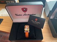Watch and instruction manual displayed inside Tonino Lamborghini box