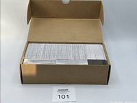 Brown storage box filled with tightly packed 2024-25 Upper Deck Tim Hortons hockey cards.