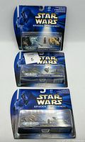 Three Star Wars Episode 1 Micro Machines sets in blister packaging, Collections 1 to 3 visible.