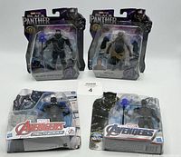 Four Marvel Black Panther-related action figures in original packaging shown from front. Two from Black Panther Legacy series and two from Avengers Mech Strike series.