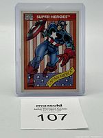 Front view of Captain America #1 1990 Marvel Super Heroes trading card in protective sleeve showing full artwork and branding.