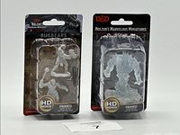 Photo of lot showing two D&D Nolzur's Marvelous Miniatures in packaging featuring two Bugbear figures, primed and paint-ready.