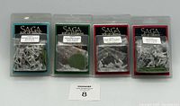 Photo of four sealed Gripping Beast Saga Miniatures packs from Age of Magic, Invasions, and Vikings series