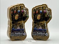 Two identical Marvel Avengers Infinity Gauntlet puzzle tins side by side, showing the front design, puzzle piece count, and branding.