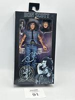 Neca AC/DC Bon Scott Highway to Hell 8-inch clothed action figure in original packaging with extra interchangeable head.