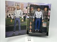 Complete NECA Ultimate Biff Tannen 7-inch action figure set in original box, showing figure with accessories and alternate face included.