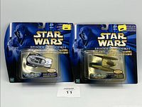 Two sealed Star Wars Micro Machines Episode I die-cast metal vehicles in original packaging, showing front of blister cards with logo and character image.