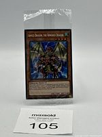 Sealed original plastic-wrapped YuGiOh Armed Dragon, The Armored Dragon card with seller's auction label