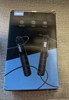 Front of box showing Aerb electronic skipping rope with pictures of the handles and wire rope.