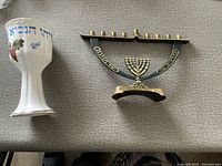 Top-down view of cup and menorah side-by-side with details visible
