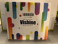 Closed box of Vishine LED & UV Nail Gel Kit with colorful abstract design