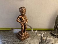 Photo of the funny corkscrew shaped as a boy peeing with spiral corkscrew