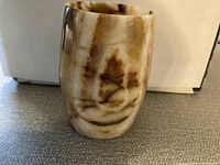 Photo of stone glass vase showing natural marbled pattern and shape.