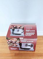 Box of Home Max Electric Food Slicer showing product image and branding
