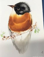 Close-up of the bird watercolor painting showing details of brushwork and signature.