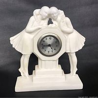 Front view of Art Deco alabaster marble clock with two female figurines and clock face
