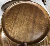 Top view of one Japanese ash wood serving tray showing wood grain and round shape.