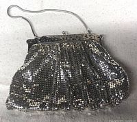 Front view of the vintage metal mesh purse showing silver tone and chain handle.