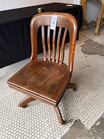 Front view of vintage GlenLocke walnut office chair showing overall design and condition.