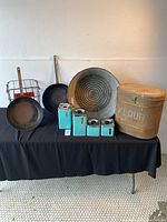 Wide shot showing all lot items including frying pans, wash basin, flour bin, utensil holder, and blue canisters.