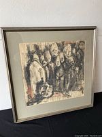 Framed charcoal drawing full view against white wall