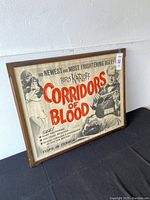 Framed Corridors of Blood movie poster angled to show full front with title and images.