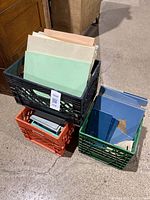 Three crates containing assorted vintage Vitrolite glass tiles of various colors and sizes, mostly 12x16 inches.