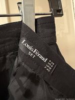 Close-up of Louis Féraud size and brand label inside the skirt, showing US size 8, UK size 12, FR size 40