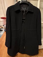Black wool blazer front view with zipper and collar