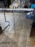 The bathroom medicine cabinet shown with mirrored front closed, reflecting the floor and surroundings.