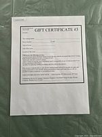Photo of full gift certificate showing services included, valid dates, and terms