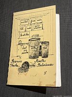 Front cover of the French vegetarian cookbook featuring illustration of pantry ingredients such as grains, nuts, and milk substitutes with handwritten style text.
