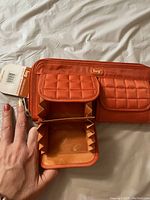 Orange Lug wallet showing double backflip accordion compartment, open to reveal interior space and craftsmanship.