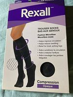 Photo showing brand Rexall, compression socks with 15-20 mmHg moderate compression, opaque and fashion microfiber material, benefits listed (improves circulation, reduces swelling).
